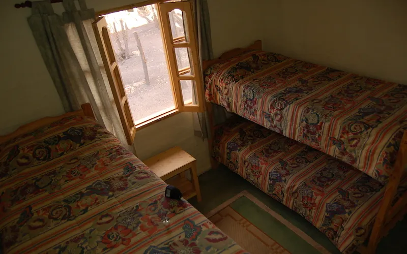 Dormitorio con camas individuales de la cabaña Gildo